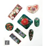 Eight assorted enamelled panels each with floral decoration, largest 7.5cm x 6.5cm. (8)