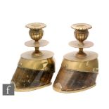 A pair of Victorian brass mounted pony hooves converted into candlesticks engraved Topsy and dated