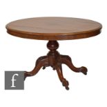 A Victorian walnut oval breakfast or loo table, raised to four outswept carved legs, height 73cm,