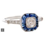 An 18ct white gold sapphire and diamond cluster ring, central old cut diamond weight approximately