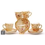 A set of five Royal Worcester shape 1471 coffee cups and saucers, each decorated with fruits and