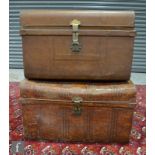 A late 19th to early 20th Century metal twin handled travelling trunk, in a painted simulated wooden