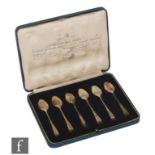 A cased set of six Silver Jubilee British Hallmarks rat tail pattern tea spoons, each with a