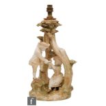 A large Royal Worcester blush ivory table lamp, shape 1240, modelled as a young boy offering a