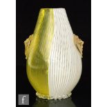 An Italian post war Venetian Murano glass vase of ovoid form with vertical yellow and white fine