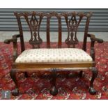 A late 20th Century mahogany reproduction miniature two seat settee in the Chippendale Revival