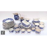 An early 20th Century part dinner service hand decorated in under glaze blue with a simple scroll