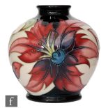 A small Moorcroft Pottery limited edition vase of footed ovoid form with flared collar neck,