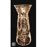 A 20th Century clear glass vase of tapering form with flared neck, with optic moulded spots above