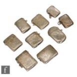 Nine assorted hallmarked silver rectangular vesta cases each with foliate engraved decoration, two