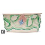 A Clarice Cliff shape 493 Scraffito wall pocket of D section, relief moulded with stylised flowers
