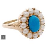 A 9ct hallmarked oval turquoise and split pearl cluster ring, central turquoise within a twelve
