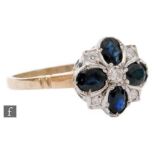 A 9ct hallmarked sapphire and diamond cluster ring shaped circular head with four oval sapphires