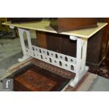 A late 19th Century oak library side table of rectangular form in the Gothic revival style, the base