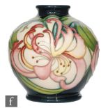 A Moorcroft Pottery vase decorated in the Hispidula Haze pattern designed by Kerry Goodwin,