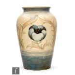 A William Moorcroft vase of shouldered ovoid form, decorated in the Anemone pattern, with