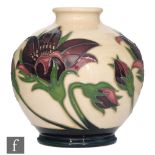 A Moorcroft Pottery vase of footed ovoid from decorated in the Pulsatilla pattern designed by
