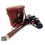 A World War one leather cased two drawer telescope by CKC pattern 332A No 700 and a pair of Carl