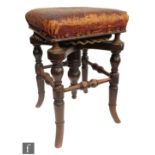 A Victorian piano stool 'The Rondlet', by Henry Brooks & Company Limited, numbered 3689 / 600, the