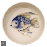 A small 1930s William Moorcroft footed bowl tubeline decorated with a fish picked out in tonal