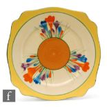 A Clarice Cliff Leda shape plate circa 1930 radially hand painted with Crocus sprays with yellow,