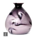 A vase of tapered ovoid form in the manner of Loetz with flared collar neck, cased in tonal purple