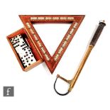 An early 20th Century triangular mahogany cribbage board with four Mr Punch brass pegs, a set of