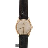 A gentleman's 9ct hallmarked Omega wrist watch, gilt batons to a silvered dial, movement numbered