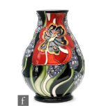 A small Moorcroft Pottery baluster form vase decorated in the Copthall Lane pattern, impressed and