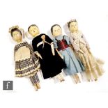 A group of four 19th Century wooden dolls each with turned heads, painted features and jointed
