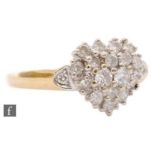 An 18ct hallmarked diamond cluster ring, heart shaped pave set head to diamond set shoulder, ring