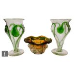 A pair of early 20th Century glass vases, each of footed tapering form with flared rim, with applied
