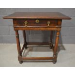 An 18th Century and later reconstructed oak side table, fitted with a single frieze drawer above a