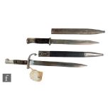 A 1940 German Mauser bayonet and scabbard stamped Coppel GMBH and another Mauser bayonet and
