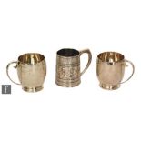 A pair of hallmarked silver half pint tankards each engraved with various signatures, with a similar