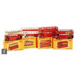 Four Dinky Toys diecast model buses, a 290 Double Deck Bus 'Dunlop' in red and cream, a 291 London