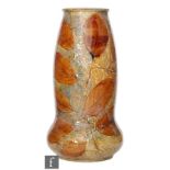An early 20th Century Royal Doulton Autumnal range vase, shape number 7564 of swollen sleeve form