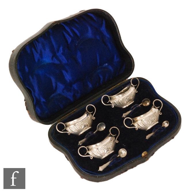 A cased set of four Victorian hallmarked silver open salts, each of boat form with embossed