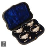 A cased set of four Victorian hallmarked silver open salts, each of boat form with embossed