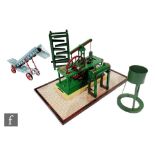 A stationary live steam scale model of a steam driven beam engine No 4 on wooden plinth with