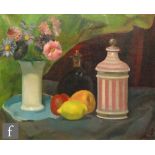 M. MANN (LATE 20TH CENTURY) - A still life composition with vase of flowers, fruit and jar on a