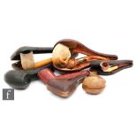 A collection of late 19th to early 20th Century cased Meerschaum pipes, including an example