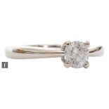 A 9ct white gold diamond solitaire ring, brilliant cut claw set stone, weight 0.50ct, colour L/M,