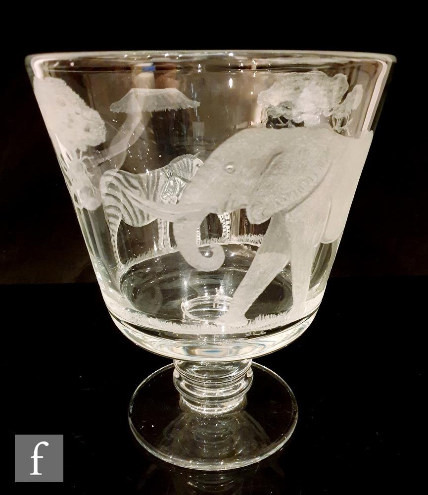 A large modern clear crystal footed goblet with knopped stem, hand engraved by John Everton with a