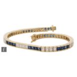 An 18ct sapphire and diamond tennis bracelet alternating sets of four channel set, square cut stones