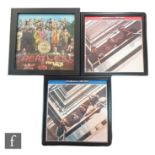 A collection of framed Beatles LPs to include Sgt Pepper's Lonely Hearts Club Band, The Beatles