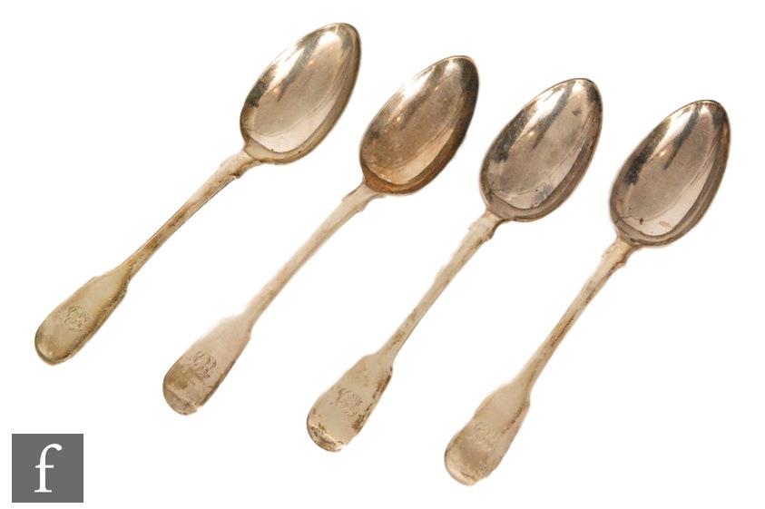 A set of four William IV hallmarked silver fiddle pattern tea spoons, each with engraved initials to