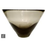 A post war Holmegaard glass bowl designed by Per Lutken, of asymmetrical flared form in a deep