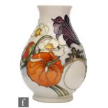 A Moorcroft Pottery baluster vase decorated in the Sandringham Bouquet pattern designed by Emma