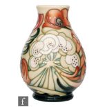A Moorcroft Pottery vase decorated in the Ode to Autumn pattern designed by Emma Bossons,